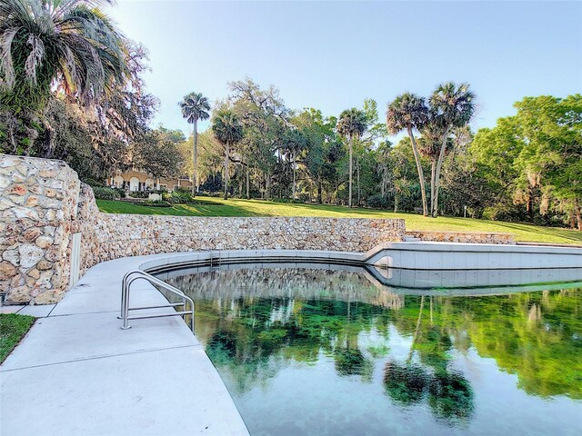 103 Red Cedar Dr, Longwood, FL 32779 - view of swimming pool featuring a water view and view of scattered trees