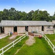 103 Red Cedar Dr, Longwood, FL 32779 - view of front of house with an exterior structure, an attached garage, and an outdoor structure