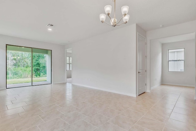 3975 Kennebunk Loop, Mount Dora, FL 32757 - unfurnished room with a chandelier, baseboards, and light tile patterned floors