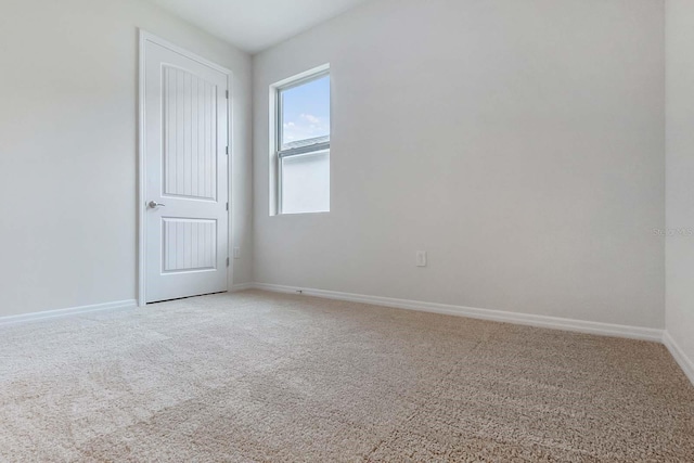 3975 Kennebunk Loop, Mount Dora, FL 32757 - spare room featuring light carpet and baseboards