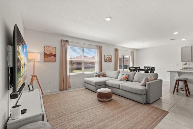 850 Lazio Cir, Debary, FL 32713 - living room with light tile patterned flooring, a textured ceiling, and recessed lighting