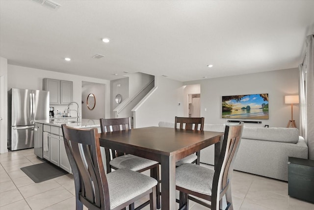 850 Lazio Cir, Debary, FL 32713 - dining area featuring light tile patterned floors, recessed lighting, and stairway
