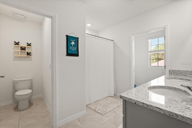 850 Lazio Cir, Debary, FL 32713 - full bathroom featuring toilet, tile patterned floors, double vanity, baseboards, and recessed lighting
