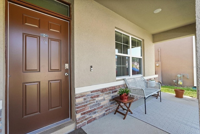 850 Lazio Cir, Debary, FL 32713 - doorway to property featuring covered porch and stucco siding