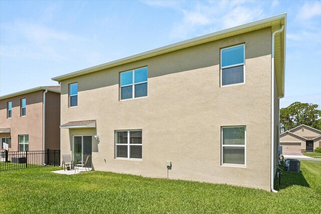 850 Lazio Cir, Debary, FL 32713 - rear view of house with stucco siding and central air condition unit