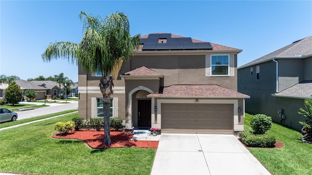 1902 Hailsham Ct, Orlando, FL 32824 - view of front of home featuring stucco siding, roof mounted solar panels, and driveway
