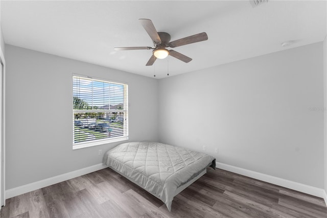 1902 Hailsham Ct, Orlando, FL 32824 - bedroom featuring baseboards, wood finished floors, and ceiling fan