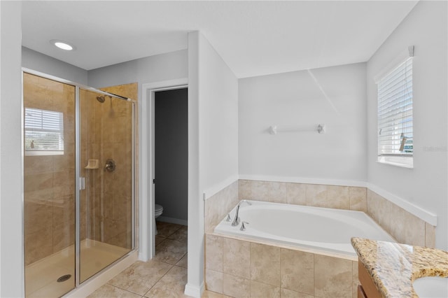 1902 Hailsham Ct, Orlando, FL 32824 - full bath with a shower stall, tile patterned floors, toilet, a bath, and vanity