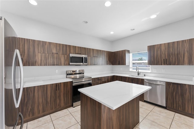 1902 Hailsham Ct, Orlando, FL 32824 - kitchen featuring stainless steel appliances, a sink, modern cabinets, light tile patterned flooring, and recessed lighting