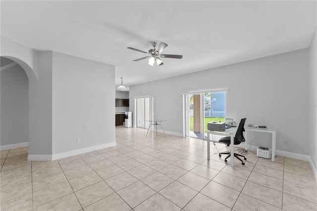 1902 Hailsham Ct, Orlando, FL 32824 - office space with arched walkways, light tile patterned flooring, ceiling fan, and baseboards