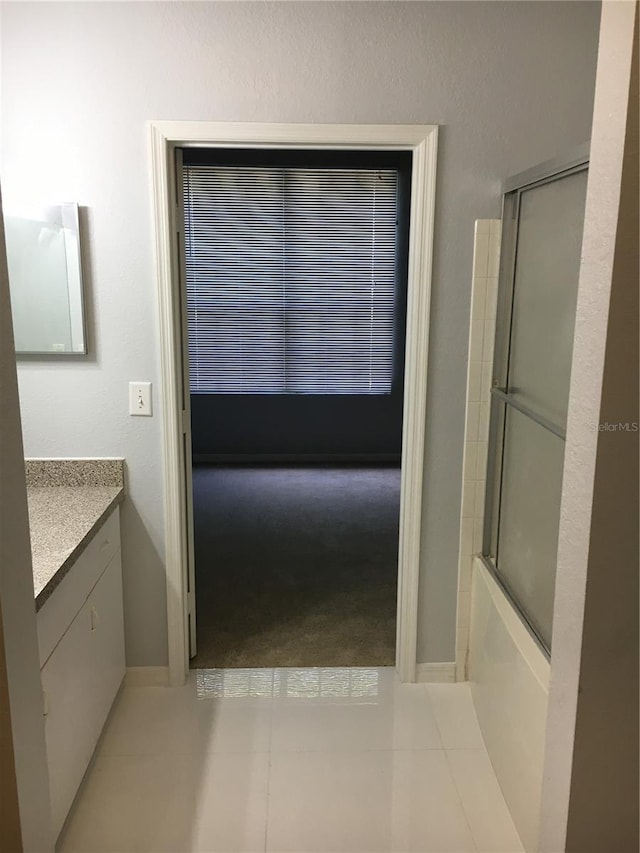full bath featuring vanity and enclosed tub / shower combo