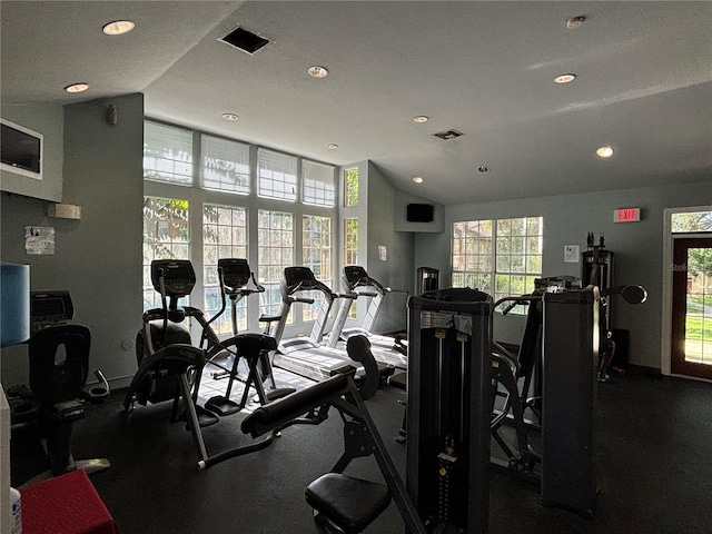 gym with vaulted ceiling, recessed lighting, and baseboards
