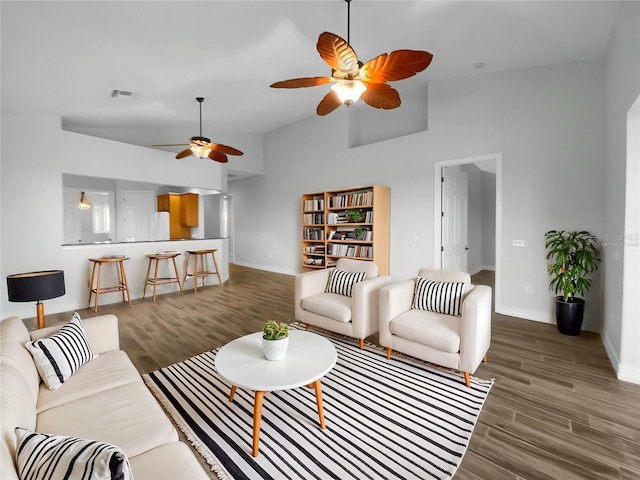 84 Camino Real Blvd, Howey In The Hills, FL 34737 - living area with a ceiling fan, baseboards, wood finished floors, and lofted ceiling