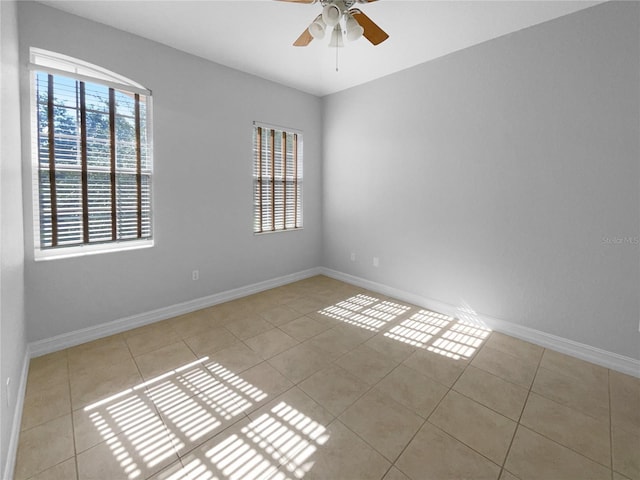 84 Camino Real Blvd, Howey In The Hills, FL 34737 - empty room with a ceiling fan, tile patterned floors, and baseboards