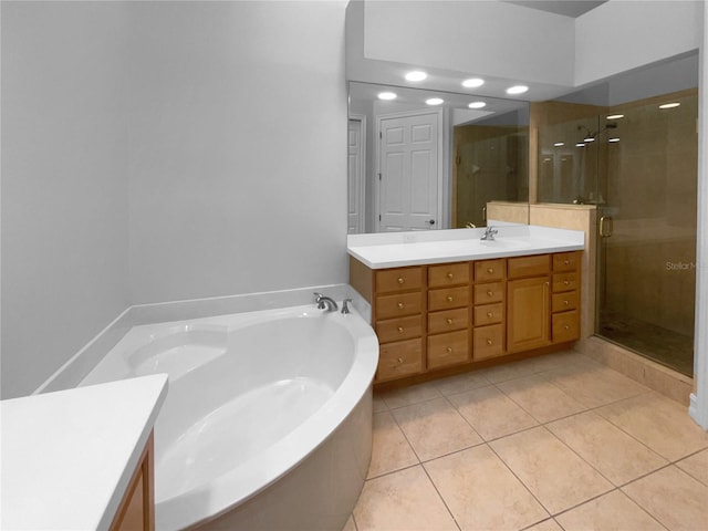 84 Camino Real Blvd, Howey In The Hills, FL 34737 - bathroom with vanity, a shower stall, a bath, and tile patterned flooring