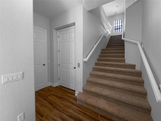 84 Camino Real Blvd, Howey In The Hills, FL 34737 - staircase featuring wood finished floors and baseboards