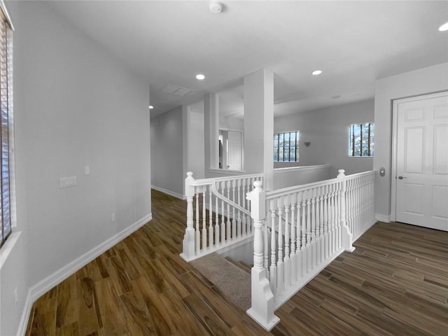 84 Camino Real Blvd, Howey In The Hills, FL 34737 - corridor featuring an upstairs landing, baseboards, wood finished floors, and recessed lighting