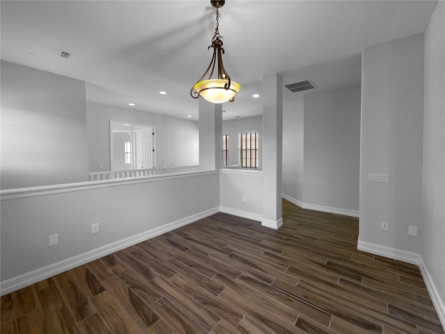 84 Camino Real Blvd, Howey In The Hills, FL 34737 - unfurnished room with dark wood-type flooring, baseboards, and recessed lighting