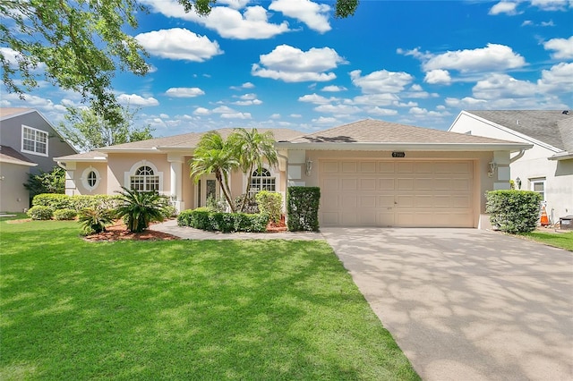 7900 Saint Giles Pl, Orlando, FL 32835 - view of front of property with an attached garage, driveway, stucco siding, and a front lawn