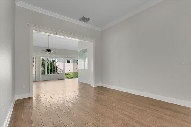 7900 Saint Giles Pl, Orlando, FL 32835 - spare room featuring light wood finished floors, baseboards, a ceiling fan, and ornamental molding