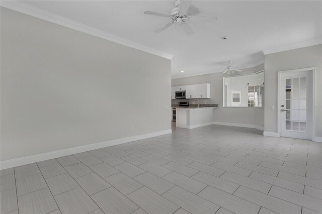 7900 Saint Giles Pl, Orlando, FL 32835 - unfurnished living room with a ceiling fan, ornamental molding, baseboards, and a sink