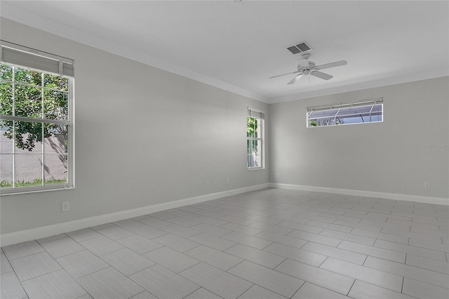 7900 Saint Giles Pl, Orlando, FL 32835 - spare room with healthy amount of natural light, ornamental molding, a ceiling fan, and baseboards