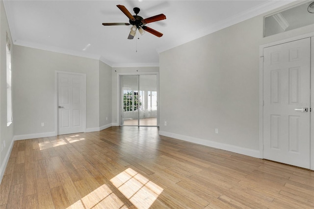 7900 Saint Giles Pl, Orlando, FL 32835 - unfurnished room featuring ceiling fan, light wood-style flooring, ornamental molding, and baseboards
