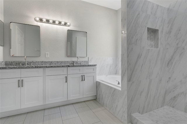 7900 Saint Giles Pl, Orlando, FL 32835 - full bath with a bath, double vanity, and tile patterned floors