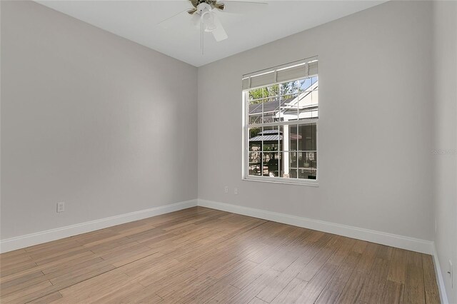 7900 Saint Giles Pl, Orlando, FL 32835 - unfurnished room featuring baseboards, light wood-style floors, and ceiling fan