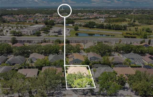 7900 Saint Giles Pl, Orlando, FL 32835 - aerial view of residential area with property parcel outlined and a large body of water