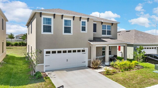 616 Griffon Ave, Lake Alfred, FL 33850 - traditional home featuring stucco siding, driveway, a front yard, an attached garage, and a shingled roof