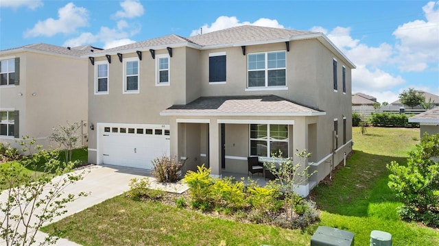 616 Griffon Ave, Lake Alfred, FL 33850 - view of front of house featuring a garage, stucco siding, a front lawn, concrete driveway, and covered porch