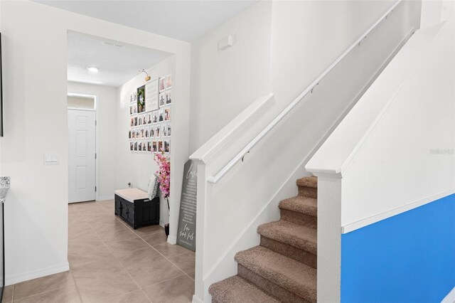 616 Griffon Ave, Lake Alfred, FL 33850 - stairs with tile patterned flooring and baseboards
