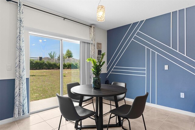 616 Griffon Ave, Lake Alfred, FL 33850 - dining space featuring baseboards and light tile patterned flooring