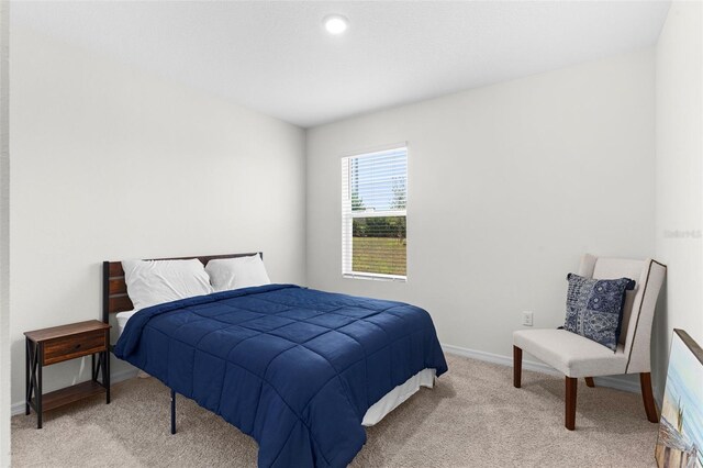 616 Griffon Ave, Lake Alfred, FL 33850 - bedroom with light colored carpet and baseboards