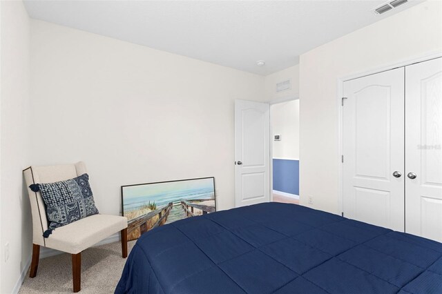 616 Griffon Ave, Lake Alfred, FL 33850 - bedroom with baseboards, carpet, and a closet