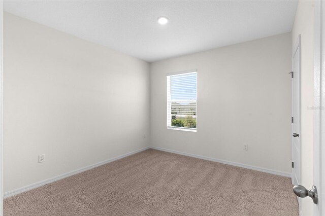 616 Griffon Ave, Lake Alfred, FL 33850 - unfurnished room with light colored carpet, baseboards, and recessed lighting