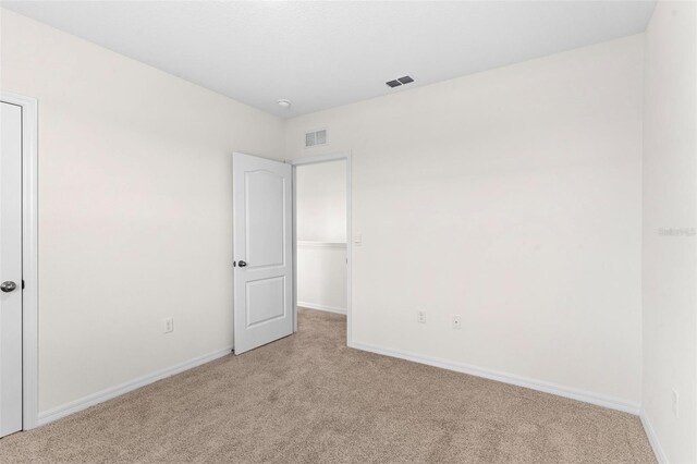 616 Griffon Ave, Lake Alfred, FL 33850 - unfurnished bedroom featuring light colored carpet and baseboards