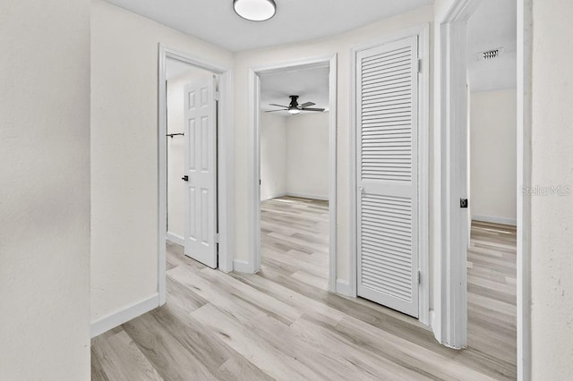 4119 Beacon Square Dr, Holiday, FL 34691 - hallway with wood finished floors and baseboards
