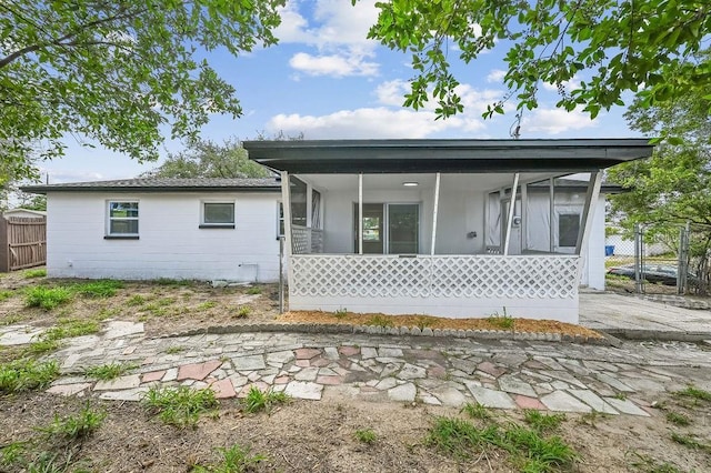 4119 Beacon Square Dr, Holiday, FL 34691 - back of house with a sunroom