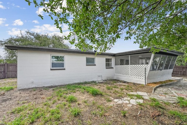 4119 Beacon Square Dr, Holiday, FL 34691 - rear view of property featuring a sunroom