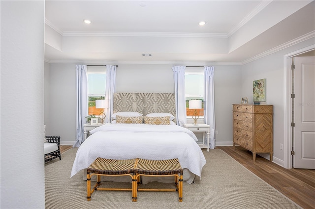 5 Heuchera Ct E, Homosassa, FL 34446 - bedroom featuring wood finished floors, ornamental molding, recessed lighting, baseboards, and a raised ceiling