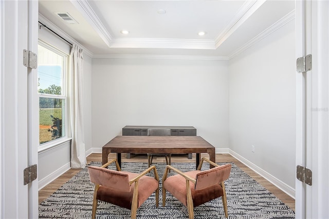 5 Heuchera Ct E, Homosassa, FL 34446 - dining room with light wood-style flooring, crown molding, baseboards, and a raised ceiling