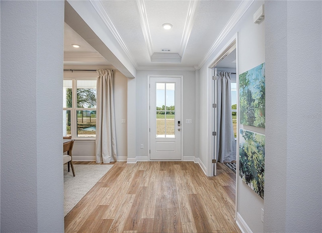 5 Heuchera Ct E, Homosassa, FL 34446 - entrance foyer with light wood-style flooring, ornamental molding, plenty of natural light, baseboards, and a raised ceiling