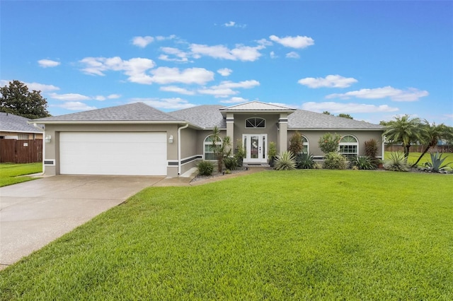 2113 Kirkland Lake Dr, Auburndale, FL 33823 - view of front of house with an attached garage, stucco siding, and driveway