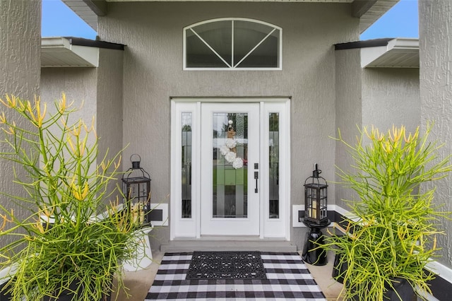 2113 Kirkland Lake Dr, Auburndale, FL 33823 - property entrance with stucco siding