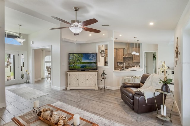 2113 Kirkland Lake Dr, Auburndale, FL 33823 - living area with ceiling fan, recessed lighting, baseboards, and wood tiled floors
