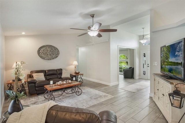 2113 Kirkland Lake Dr, Auburndale, FL 33823 - living room with vaulted ceiling, a ceiling fan, light wood-style flooring, baseboards, and recessed lighting
