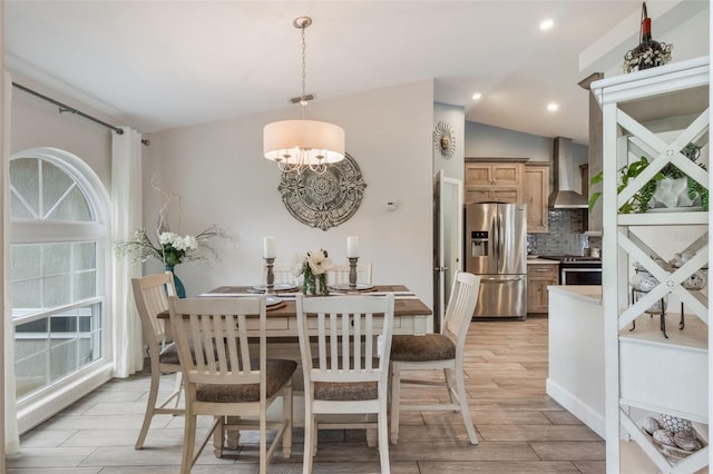2113 Kirkland Lake Dr, Auburndale, FL 33823 - dining area featuring light wood-style floors, a chandelier, vaulted ceiling, and recessed lighting