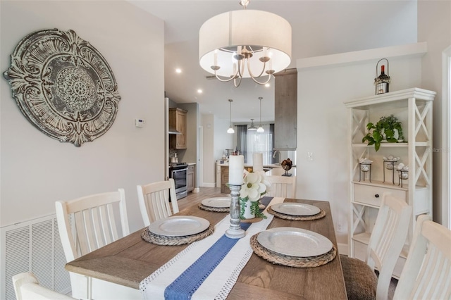2113 Kirkland Lake Dr, Auburndale, FL 33823 - dining space with a chandelier and light wood-style floors